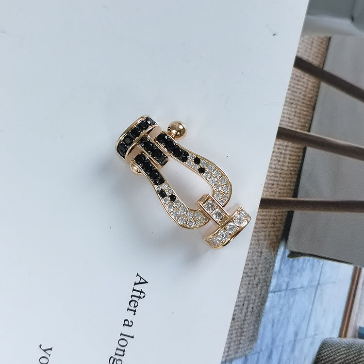 [baslovejewels]FORCE GROSSES HUFEISENARMBAND MIT SCHWARZEN WEISSEN DIAMANTEN IN ROSÉGOLD